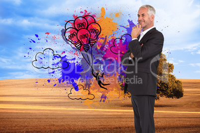 Composite image of happy businessman looking away