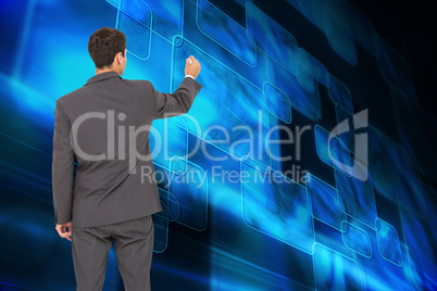 Composite image of businessman standing back to camera writing w