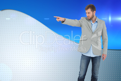 Composite image of trendy model pointing to something