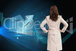 Composite image of businesswoman standing back to camera