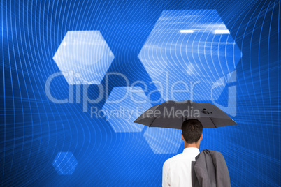 Composite image of businessman standing back to camera holding u