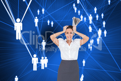 Composite image of worried stylish businesswoman holding newspap