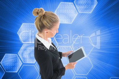 Composite image of businesswoman holding new tablet