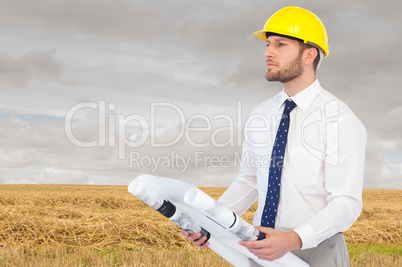 Composite image of thoughtful young architect posing