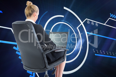 Composite image of businesswoman sitting on swivel chair with la