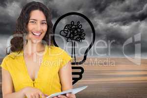 Composite image of smiling casual young woman scrolling on her t