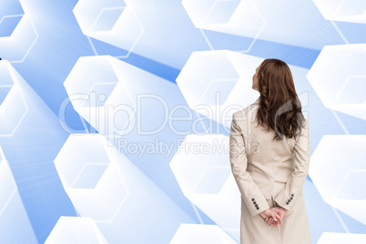 Composite image of rear view of businesswoman