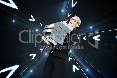 Composite image of businesswoman carrying folders