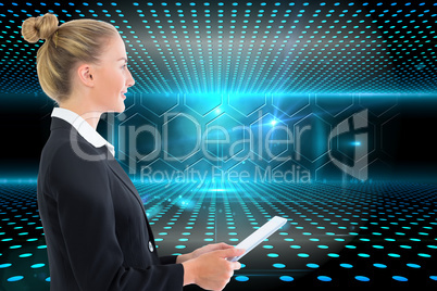 Composite image of businesswoman holding tablet