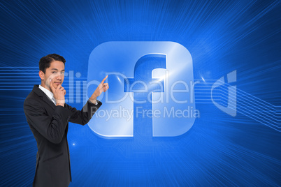 Composite image of thoughtful asian businessman pointing