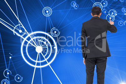 Composite image of asian businessman pointing