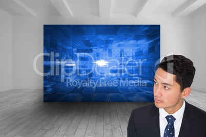 Composite image of serious asian businessman