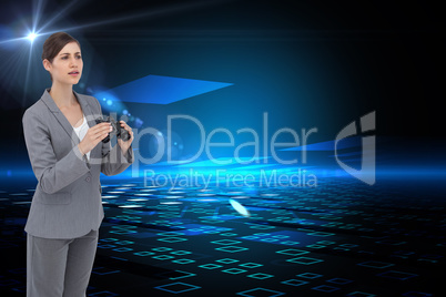 Composite image of curious young businesswoman with binoculars