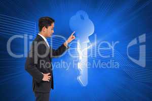 Composite image of unsmiling asian businessman pointing