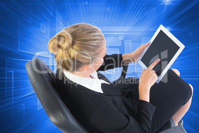 Composite image of businesswoman sitting on swivel chair with ta