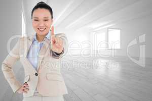 Composite image of smiling asian businesswoman pointing