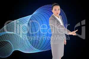 Composite image of unsmiling asian businesswoman pointing