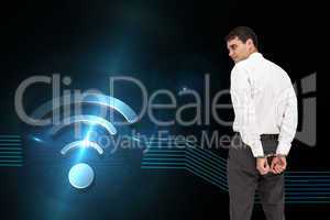 Composite image of businessman wearing handcuffs