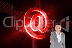 Composite image of smiling asian businesswoman pointing