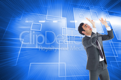 Composite image of scared businessman with arms raised