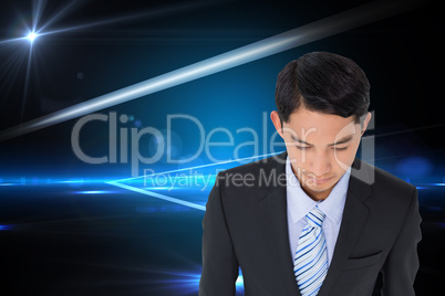 Composite image of serious asian businessman