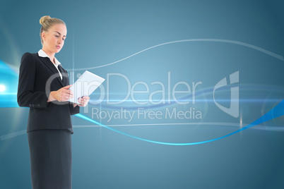 Composite image of businesswoman holding new tablet