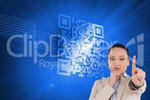 Composite image of thoughtful asian businesswoman pointing