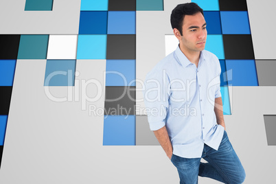 Composite image of unsmiling casual man standing