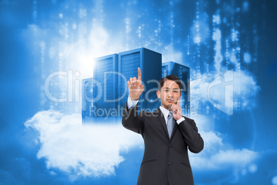 Composite image of thoughtful asian businessman pointing