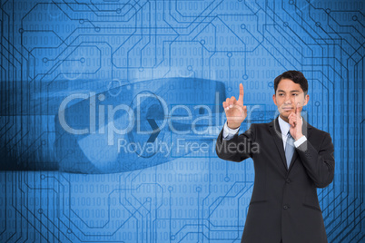 Composite image of thoughtful asian businessman pointing