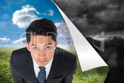 Composite image of serious asian businessman