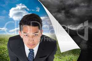 Composite image of serious asian businessman