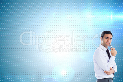 Composite image of thinking businessman holding glasses