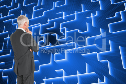 Composite image of thoughtful businessman standing back to camer