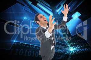 Composite image of excited businessman with arms raised