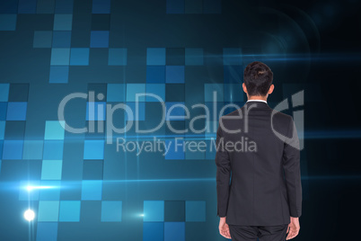 Composite image of rear view of businessman