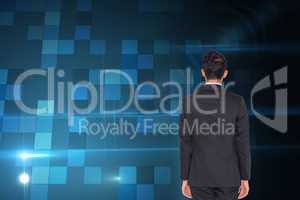 Composite image of rear view of businessman