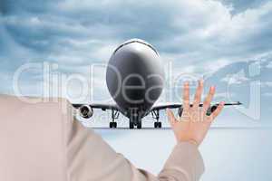 Composite image of businesswoman touching