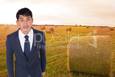 Composite image of unsmiling casual businessman walking