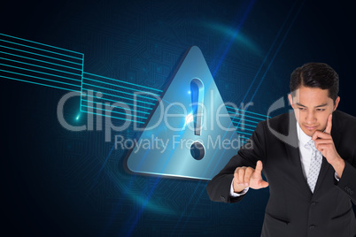 Composite image of thoughtful asian businessman pointing