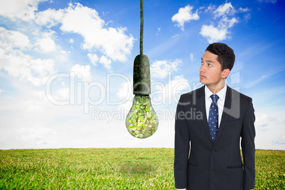 Composite image of serious asian businessman