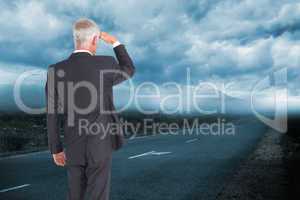 Composite image of rear view of mature businessman looking away