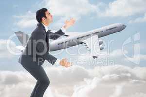 Composite image of unsmiling businessman catching