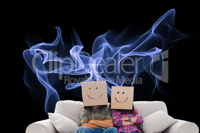 Composite image of silly employees with arms folded wearing boxe