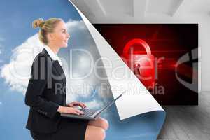 Composite image of businesswoman using laptop