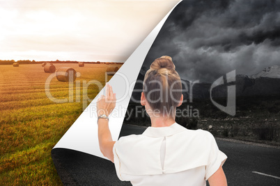 Composite image of businesswoman touching something