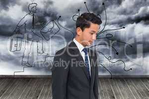Composite image of serious attractive asian businessman
