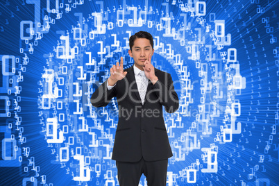 Composite image of thoughtful asian businessman pointing