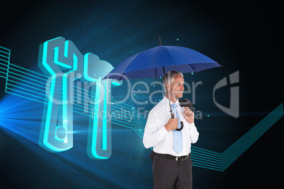 Composite image of happy businessman holding umbrella