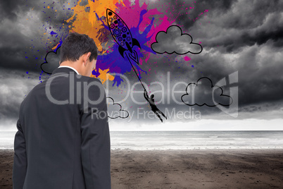 Composite image of rocket on splashes over stormy background